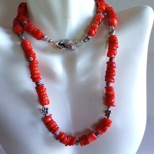 NATURAL RED CORAL HEISHI CUT W/ FIGURAL FISH CLASP